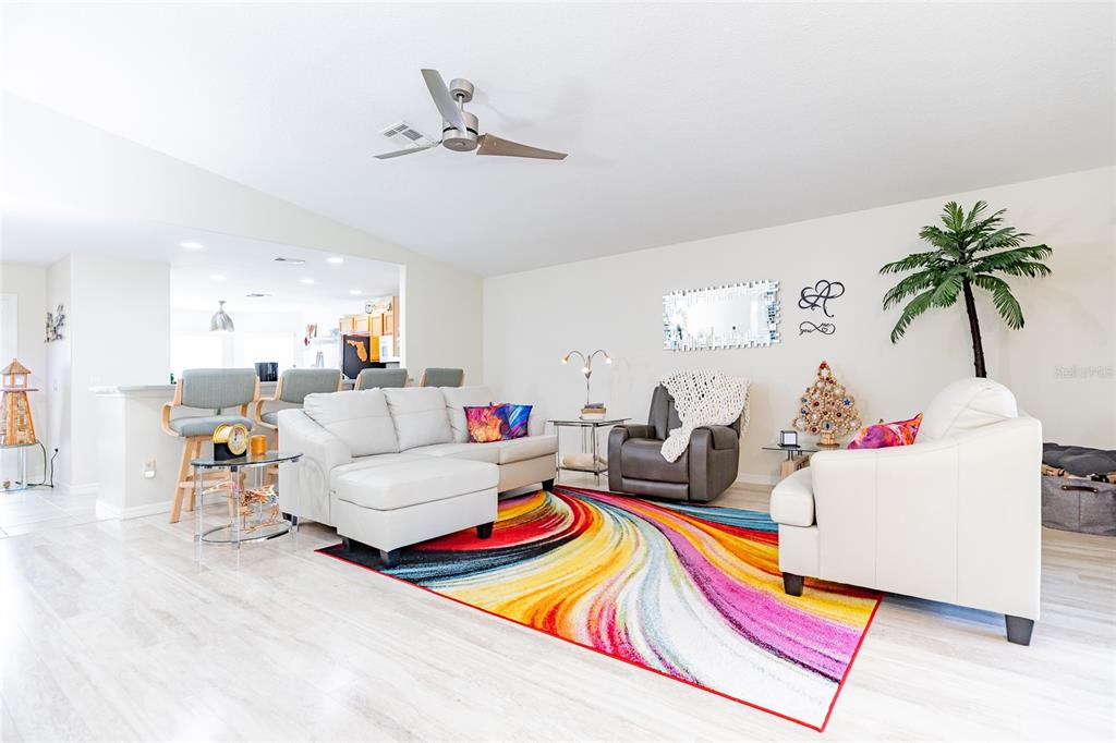 15858 Southwest 11th Court Road Ocala, FL 34473 - Photo 11 of 59 a living room with furniture and kitchen view