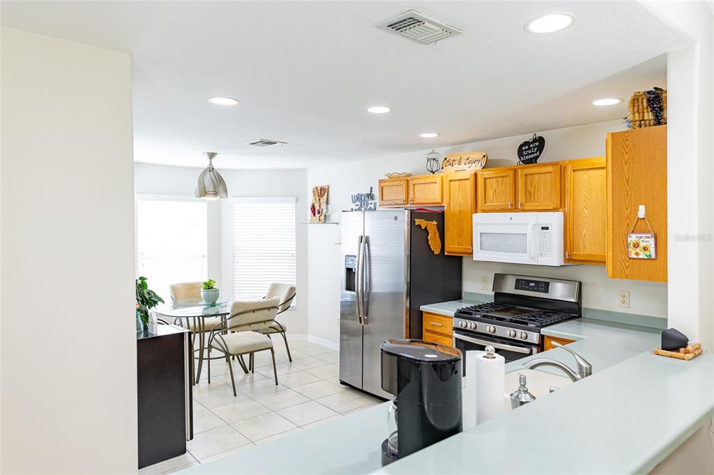 15858 Southwest 11th Court Road Ocala, FL 34473 - Photo 12 of 59 a living room with furniture and a flat screen tv
