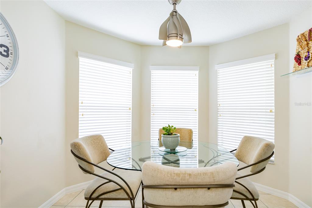 15858 Southwest 11th Court Road Ocala, FL 34473 - Photo 14 of 59 a view of a dining room with furniture and window