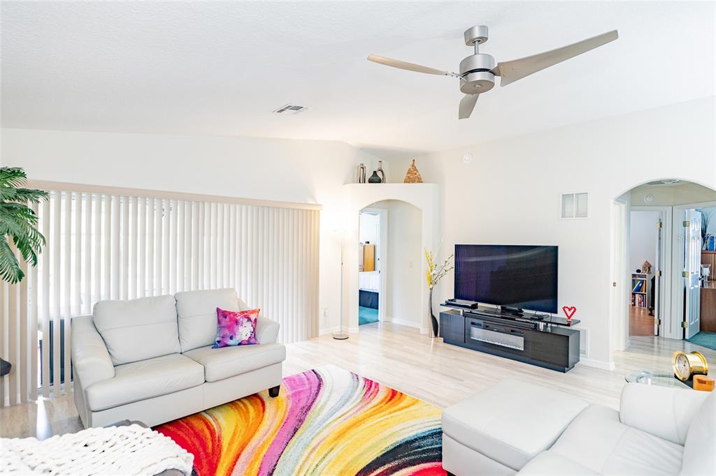 15858 Southwest 11th Court Road Ocala, FL 34473 - Photo 20 of 59 a living room with furniture and a flat screen tv