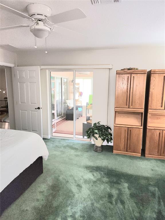 15858 Southwest 11th Court Road Ocala, FL 34473 - Photo 24 of 59 a spacious bedroom with a bed and large windows