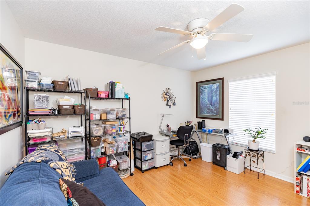 15858 Southwest 11th Court Road Ocala, FL 34473 - Photo 30 of 59 a living room with furniture and a wooden floor