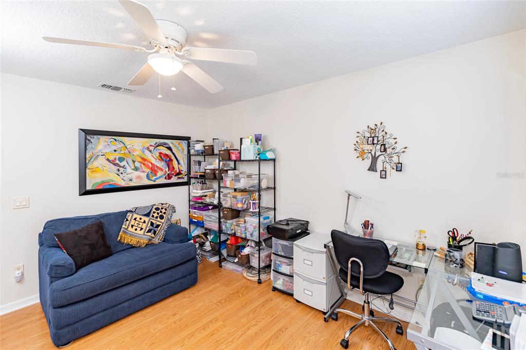 15858 Southwest 11th Court Road Ocala, FL 34473 - Photo 31 of 59 a living room with furniture and a flat screen tv