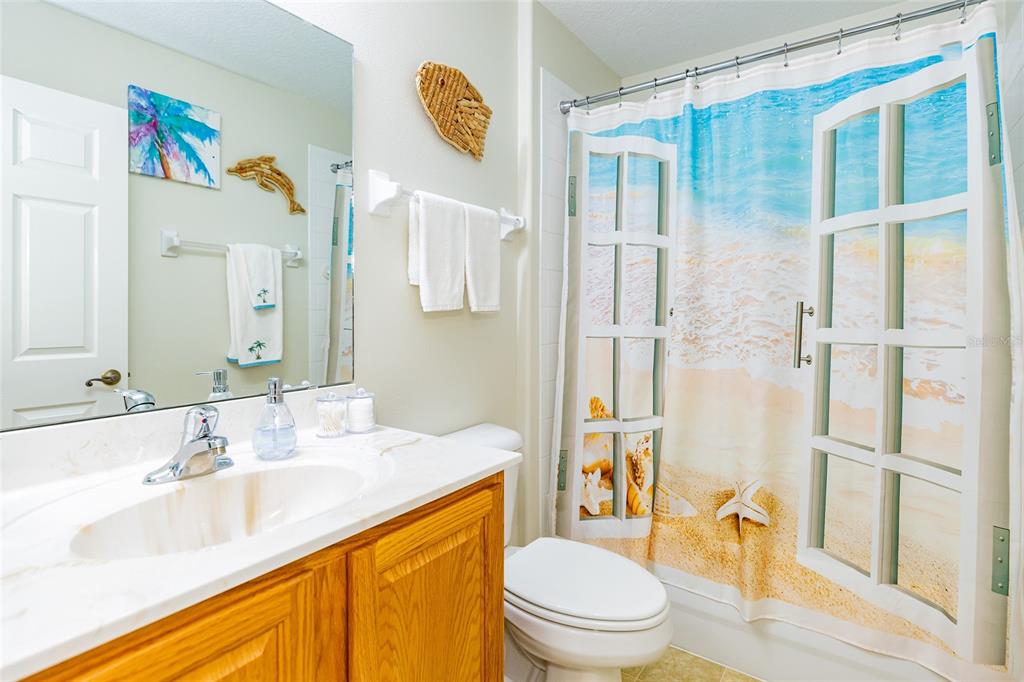 15858 Southwest 11th Court Road Ocala, FL 34473 - Photo 32 of 59 a bathroom with a sink a toilet and shower