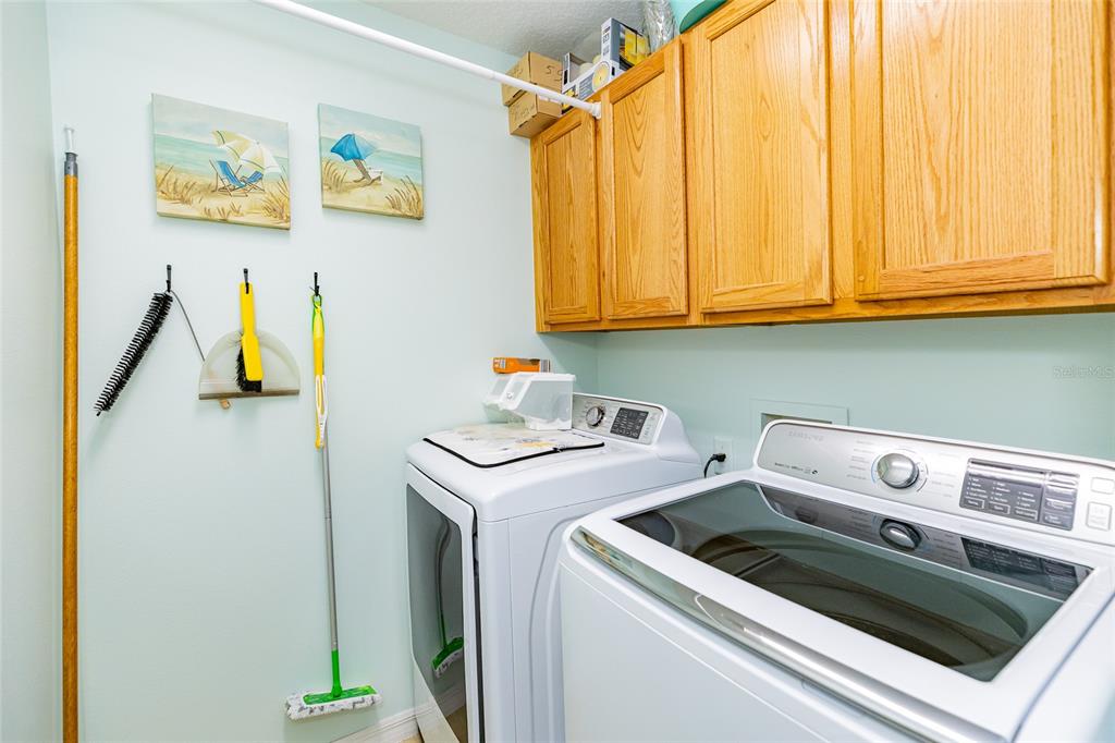 15858 Southwest 11th Court Road Ocala, FL 34473 - Photo 34 of 59 a utility room with dryer and washer