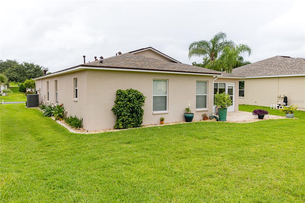 15858 Southwest 11th Court Road Ocala, FL 34473 - Photo 44 of 59 a view of a house with a yard and plants