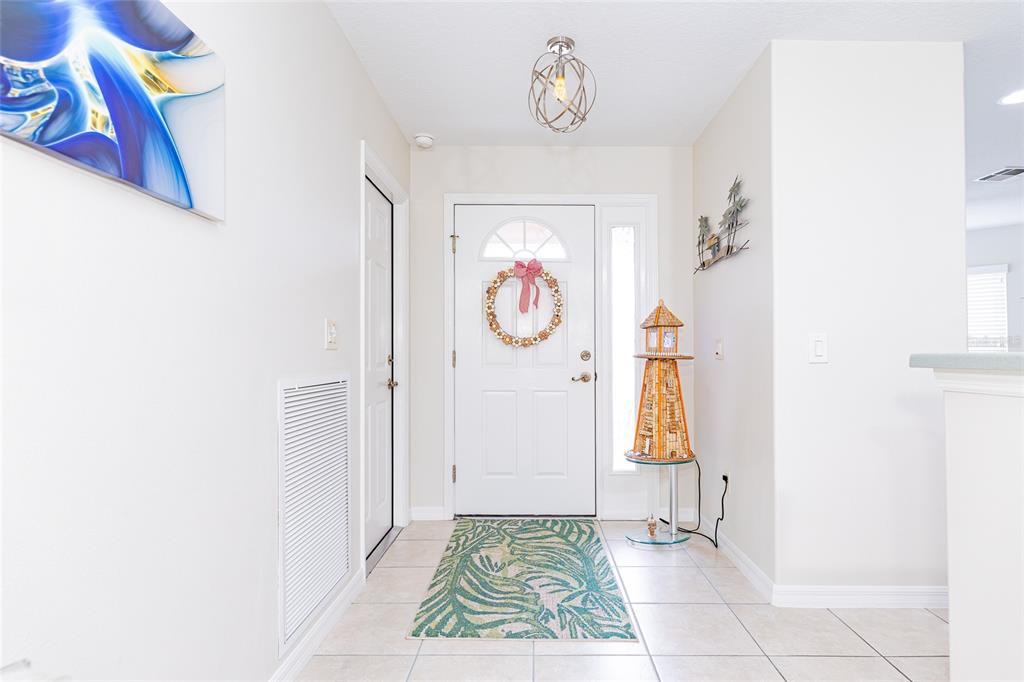 15858 Southwest 11th Court Road Ocala, FL 34473 - Photo 6 of 59 a view of an entryway with wooden floor