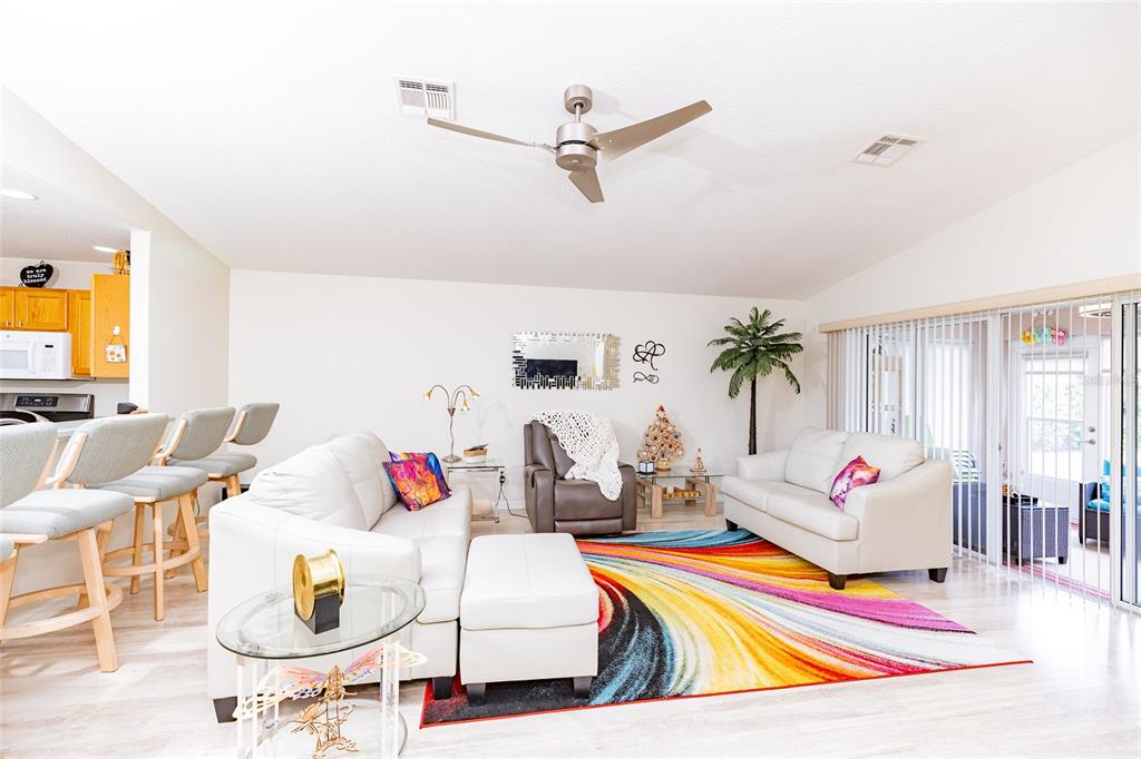 15858 Southwest 11th Court Road Ocala, FL 34473 - Photo 9 of 59 a living room with furniture and a flat screen tv