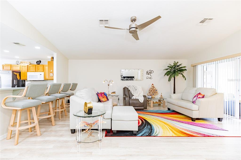 15858 Southwest 11th Court Road Ocala, FL 34473 - Photo 10 of 59 a living room with furniture and a table