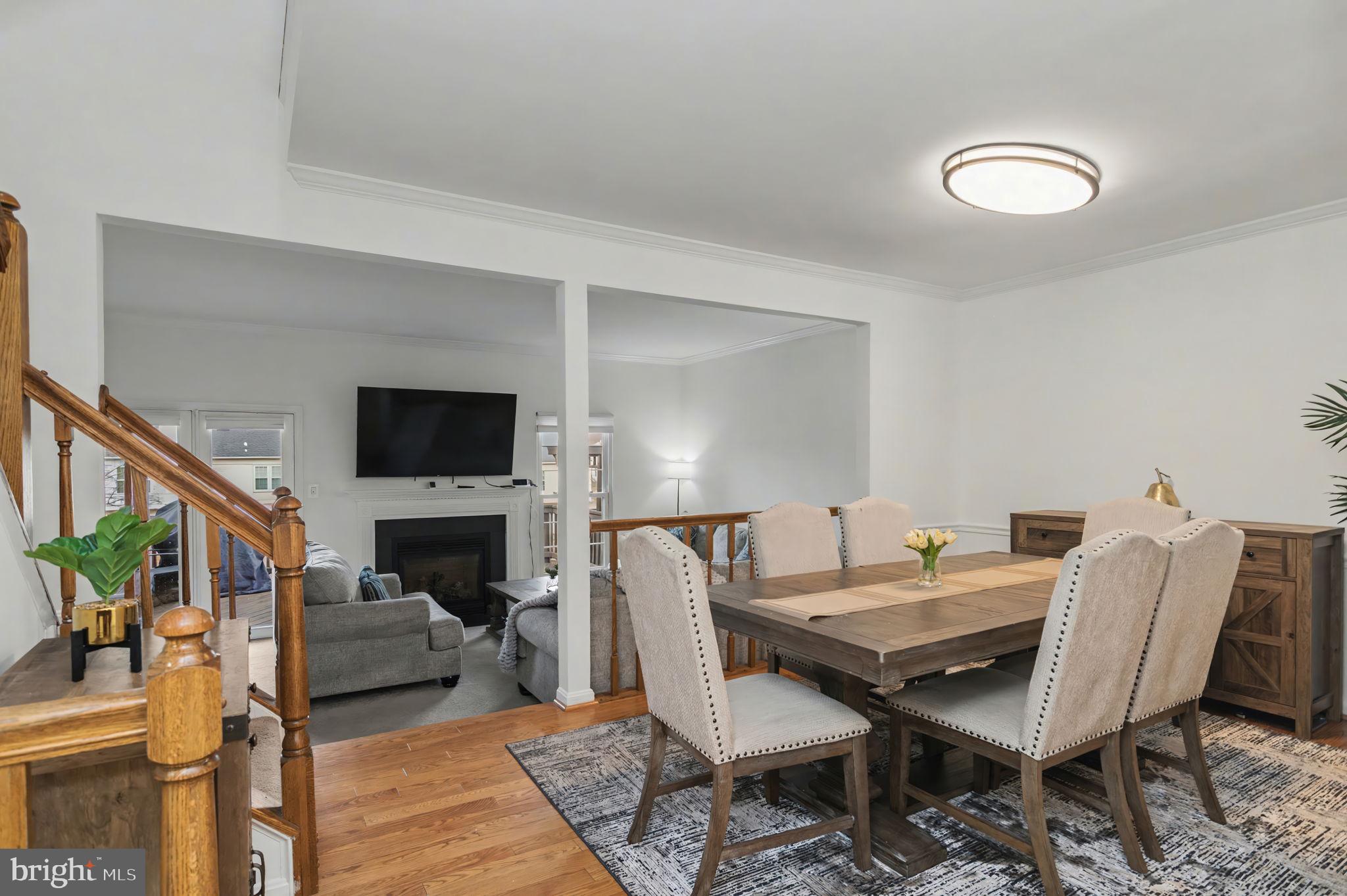 43484 Blacksmith Square Ashburn, VA 20147 - Photo 8 of 69 a view of a livingroom with furniture and a fireplace