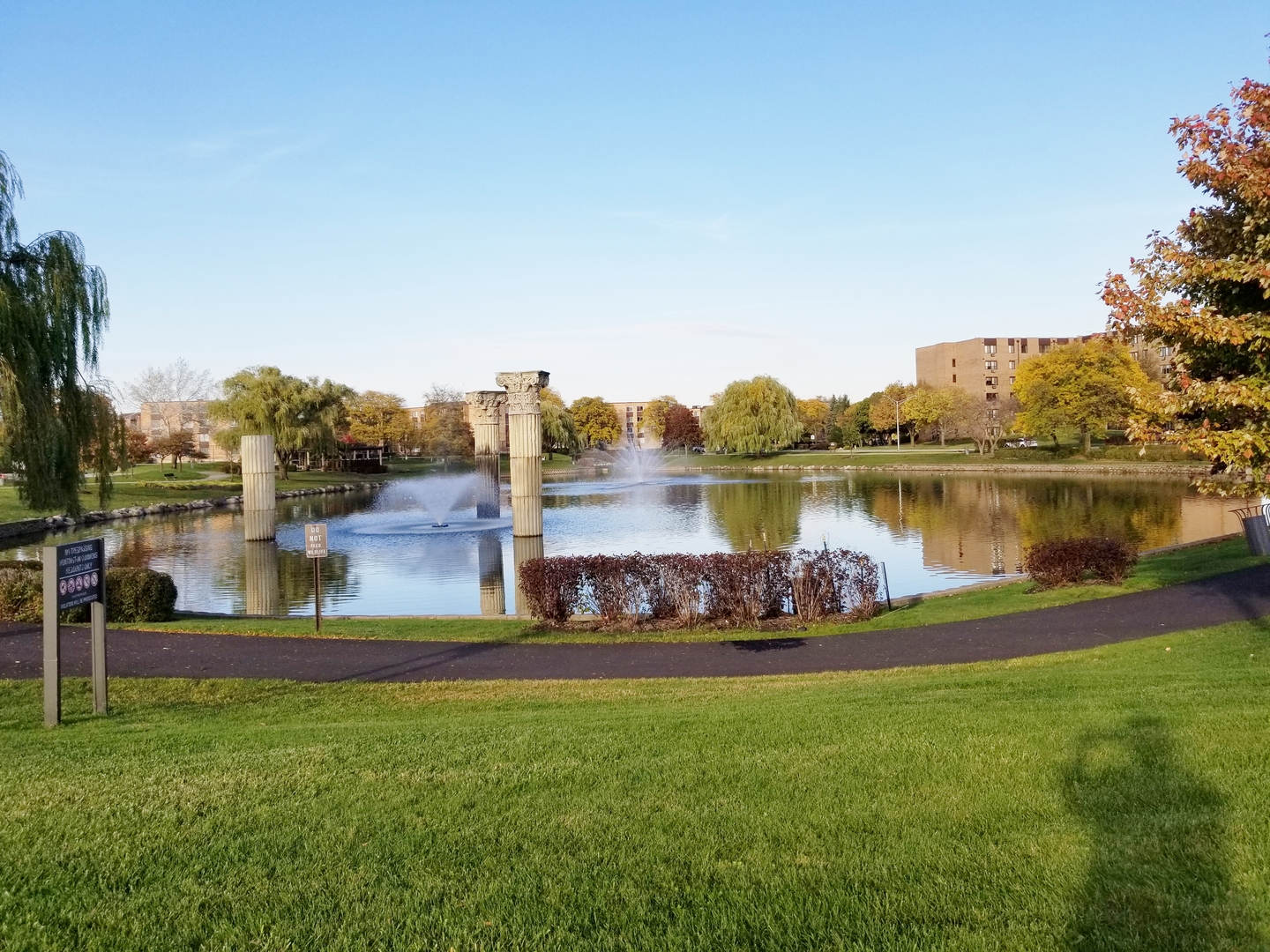 725 West Huntington Commons Road, Unit 416 Mount Prospect, IL 60056 - Photo 17 of 17 a view of a house with a yard and a fountain