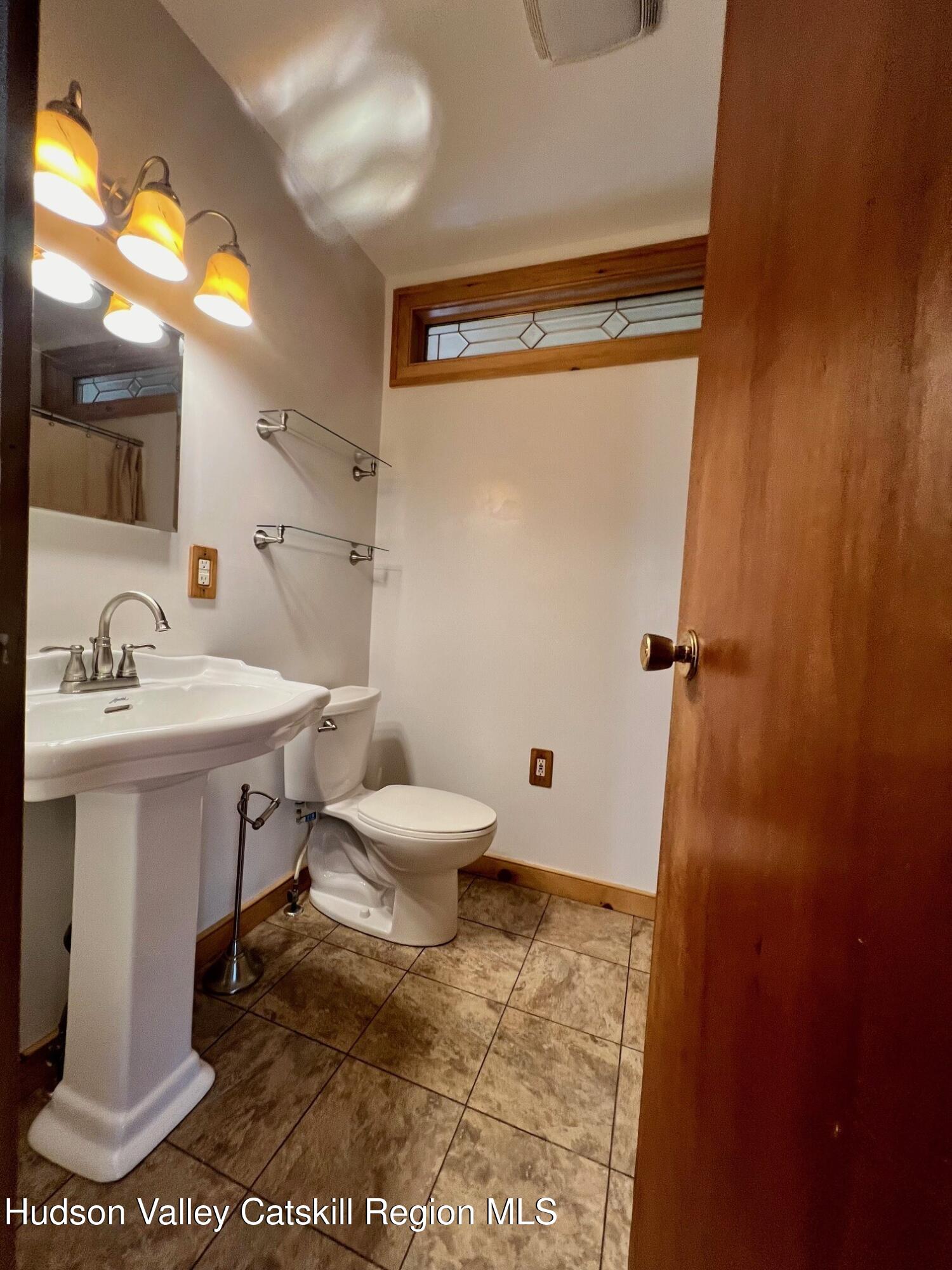 2 Shokan Park Road Shokan, NY 12481 - Photo 14 of 42 a bathroom with a sink a toilet and shower