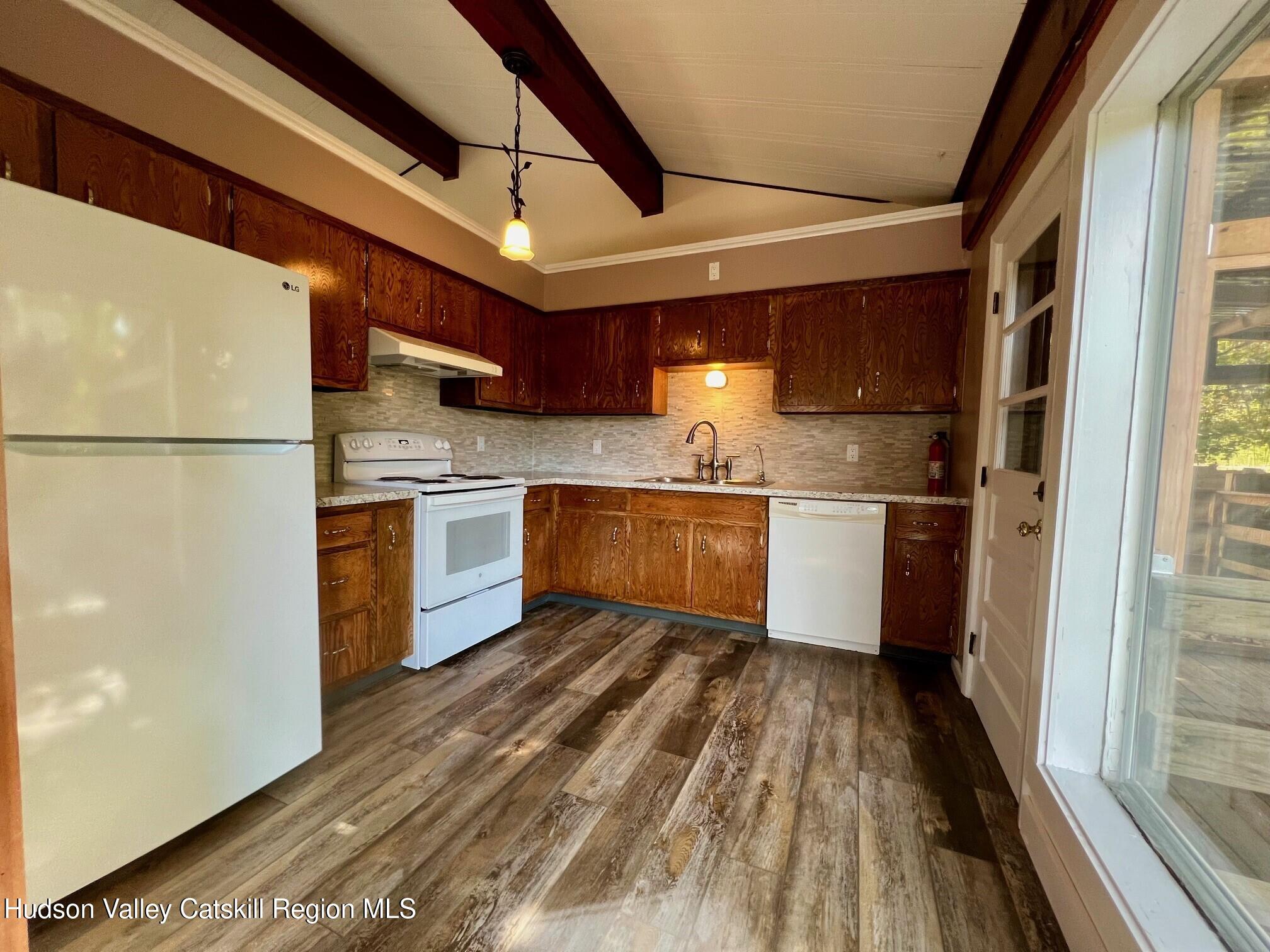 2 Shokan Park Road Shokan, NY 12481 - Photo 7 of 42 a kitchen with stainless steel appliances granite countertop a refrigerator a sink and a stove