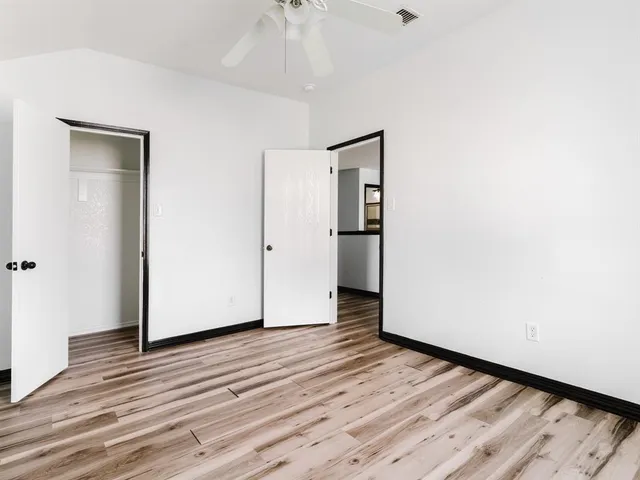 a view of a livingroom with wooden floor and closet