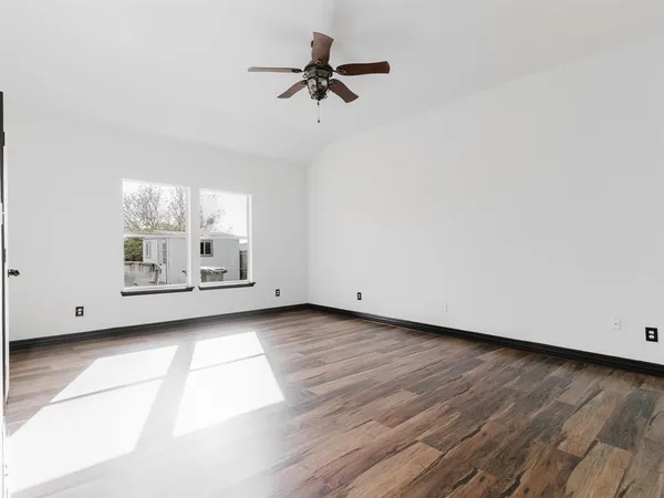 a view of livingroom with hardwood floor and a ceiling fan