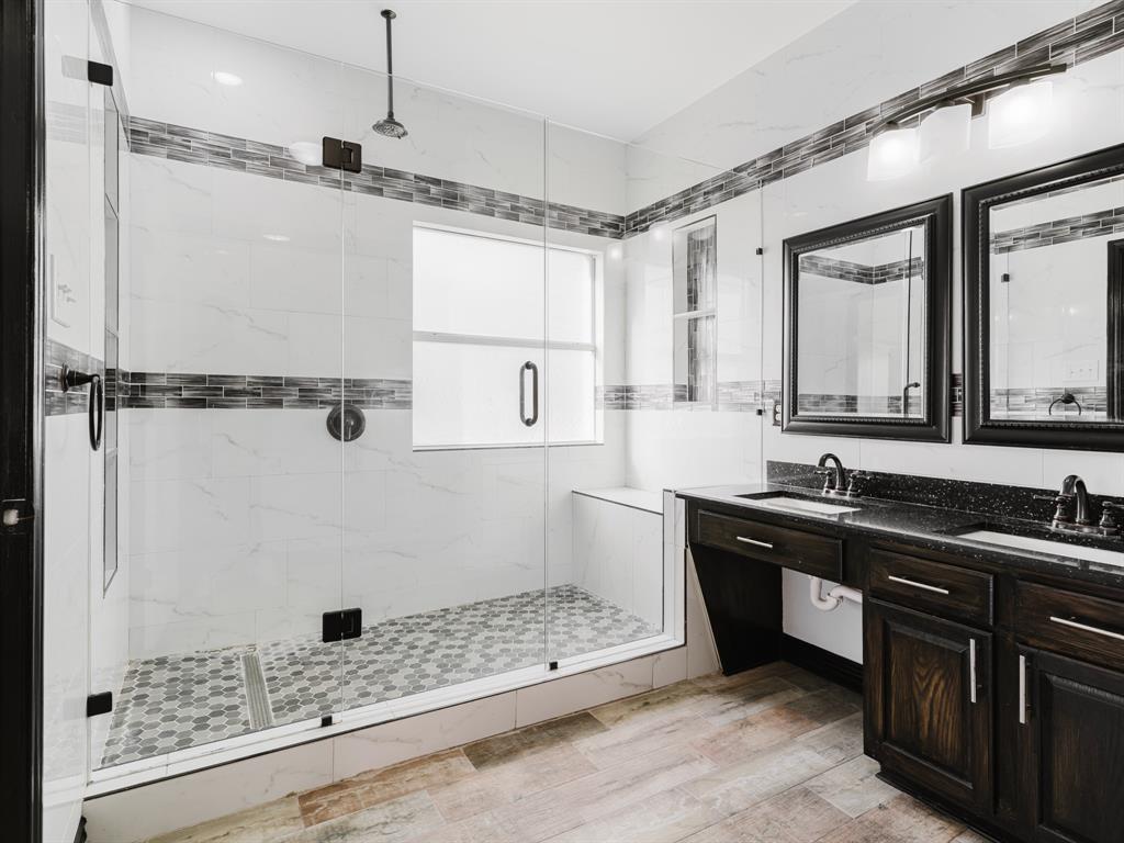 1733 Elm Street Anna, TX 75409 - Photo 7 of 25 Full bathroom with double vanity, a marble finish shower, and light wood finished floors