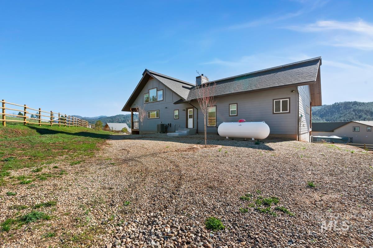21 Open Road Garden Valley, ID 83622 - Photo 43 of 49 Back of house featuring a mountain view and a chimney