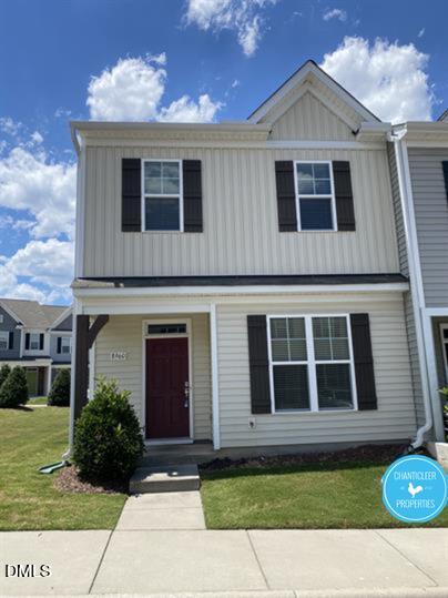 8960 Commons Townes Drive Raleigh, NC 27616 - Photo 1 of 13 a front view of a house with a yard