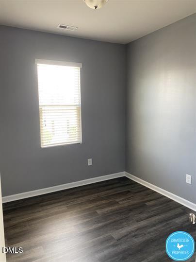 8960 Commons Townes Drive Raleigh, NC 27616 - Photo 7 of 13 a view of a room with wooden floor and windows