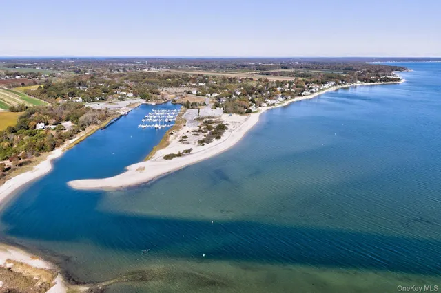 a living room with furniture and a dining table