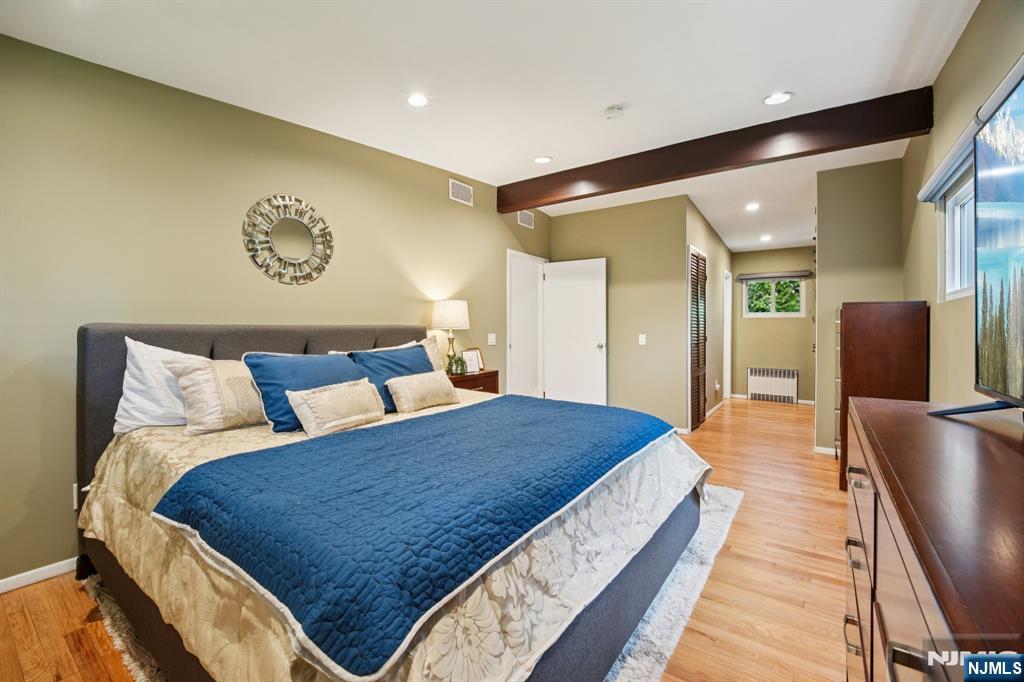 208 Prospect Avenue Oradell, NJ 07649 - Photo 20 of 50 a bedroom with a large bed and a walk in closet