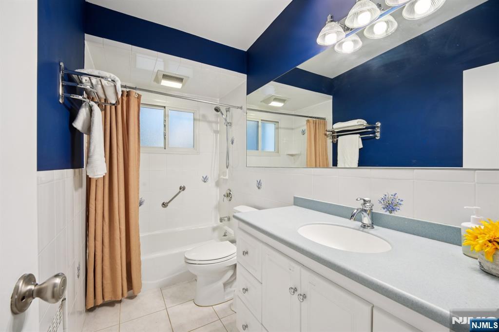 208 Prospect Avenue Oradell, NJ 07649 - Photo 27 of 50 a bathroom with a sink a toilet and shower