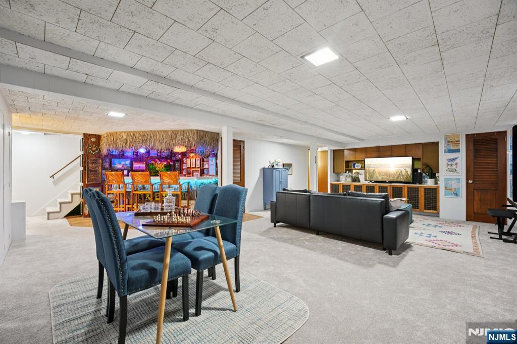 208 Prospect Avenue Oradell, NJ 07649 - Photo 33 of 50 a dining room with furniture and a kitchen view