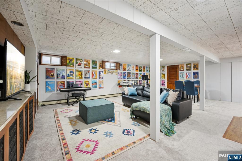 208 Prospect Avenue Oradell, NJ 07649 - Photo 36 of 50 a living room with furniture and a flat screen tv