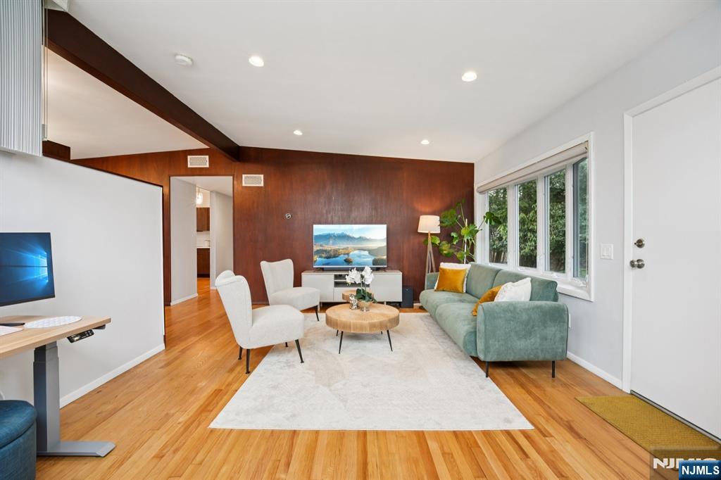 208 Prospect Avenue Oradell, NJ 07649 - Photo 7 of 50 a living room with fireplace furniture and a wooden floor