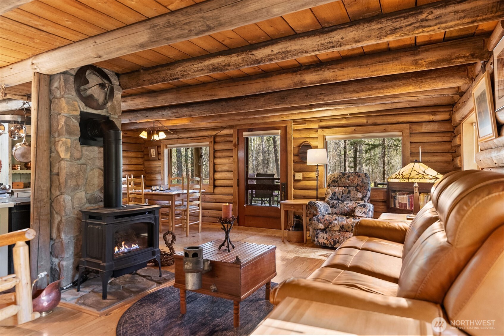583 B Twisp River Road Twisp, WA 98856 - Photo 8 of 39 a living room with fireplace furniture and a large window