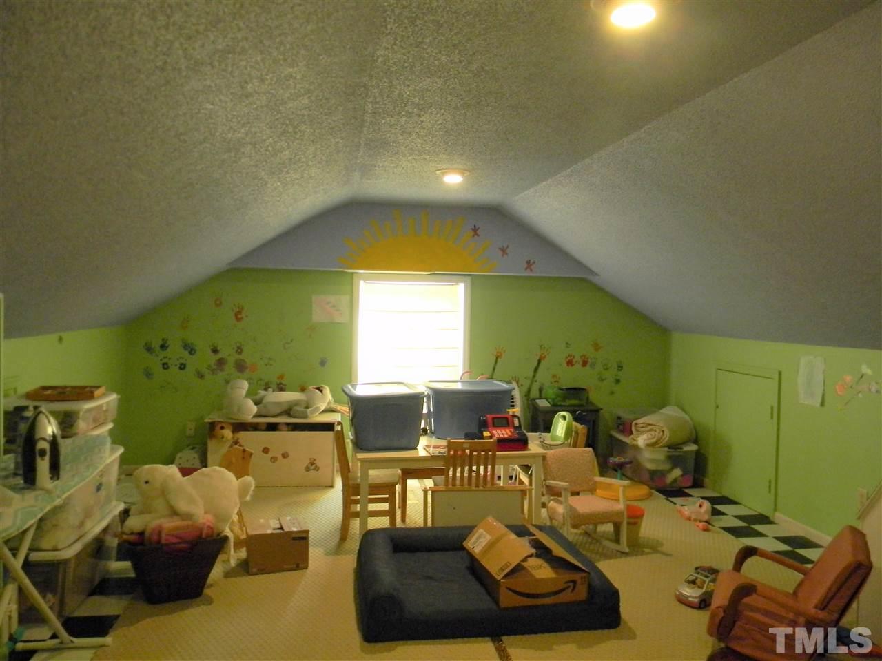 7919 Harps Mill Road Raleigh, NC 27615 - Photo 15 of 29 a living room with furniture