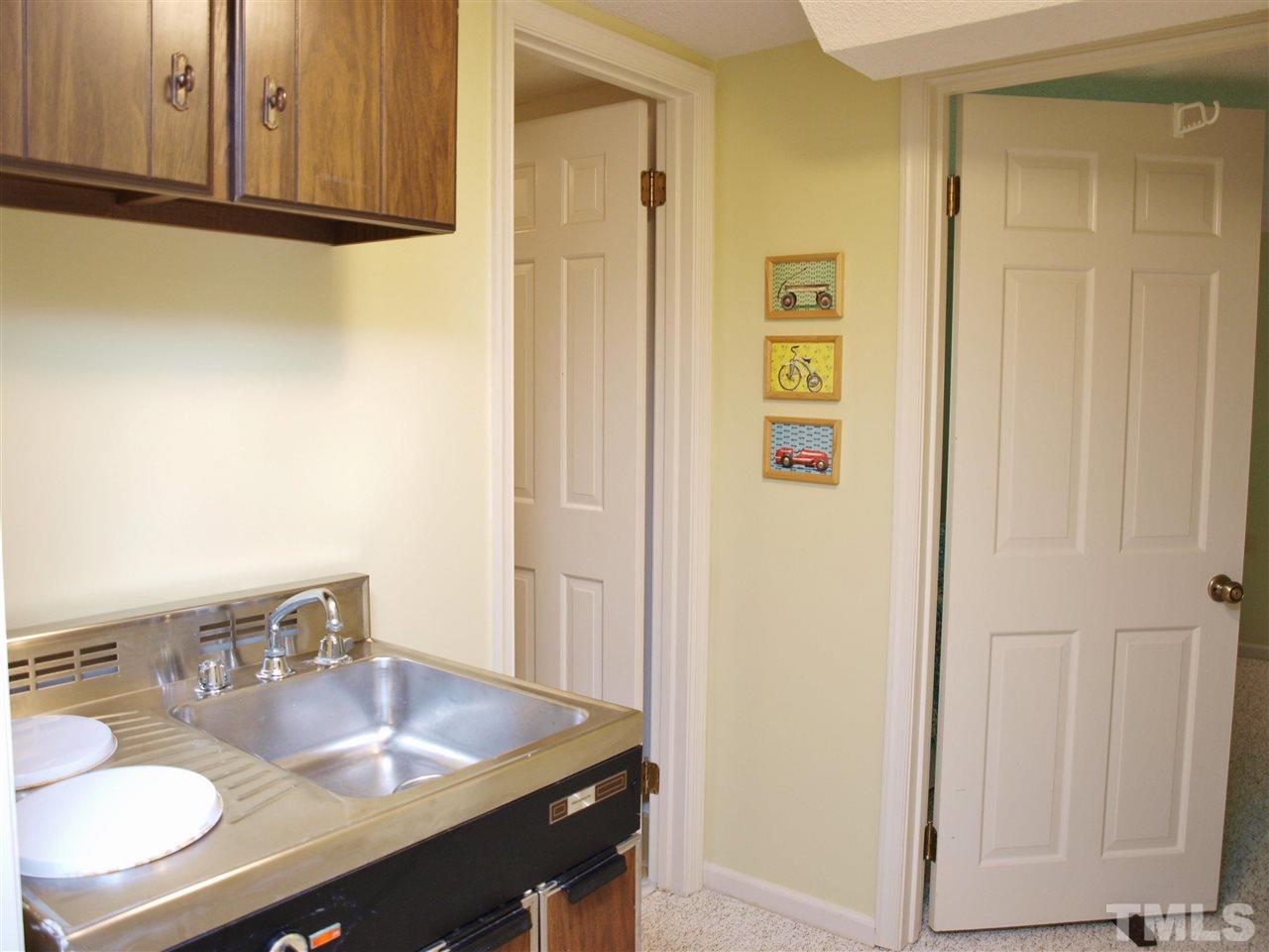 7919 Harps Mill Road Raleigh, NC 27615 - Photo 18 of 29 a dining room with table chairs and wooden floor