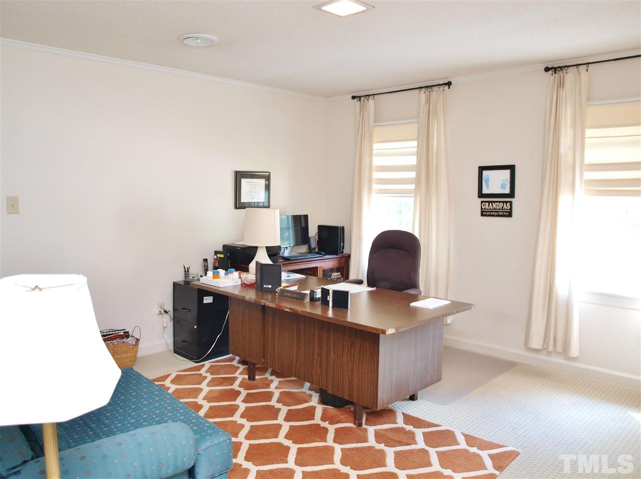 7919 Harps Mill Road Raleigh, NC 27615 - Photo 23 of 29 a view of a workspace with furniture and a window