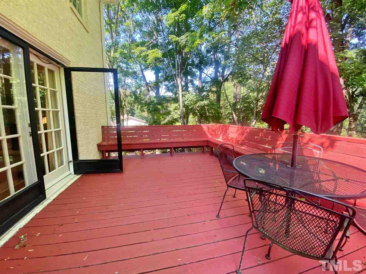 7919 Harps Mill Road Raleigh, NC 27615 - Photo 27 of 29 a balcony with chairs and wooden floor