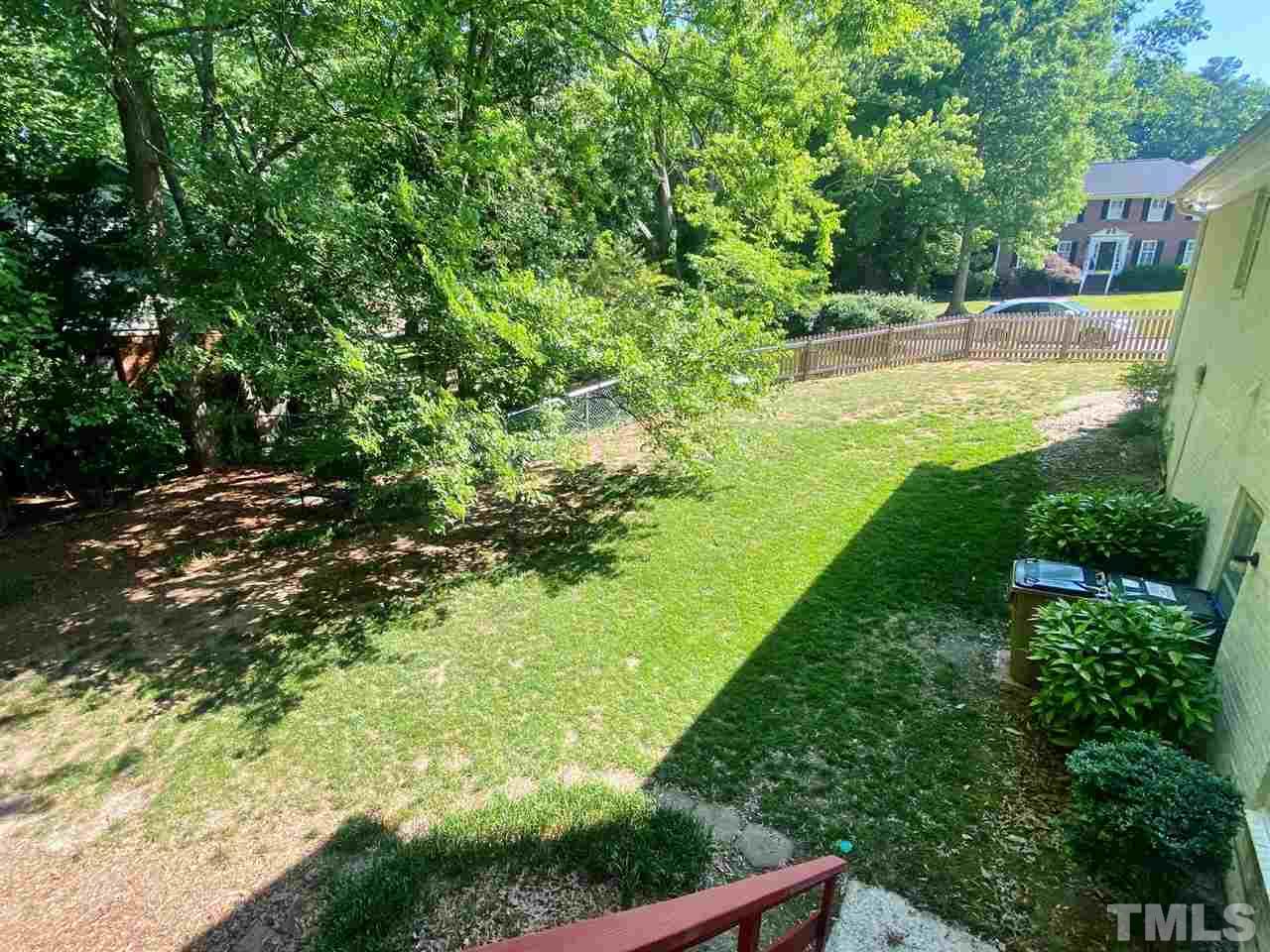 7919 Harps Mill Road Raleigh, NC 27615 - Photo 28 of 29 a view of an outdoor space and a yard
