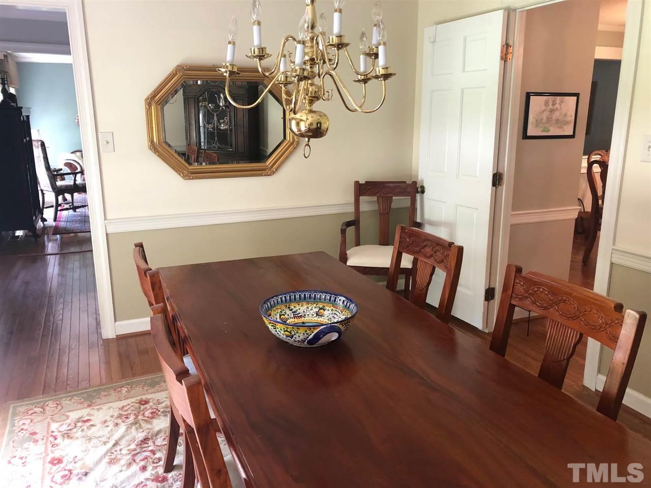 7919 Harps Mill Road Raleigh, NC 27615 - Photo 4 of 29 a living room with furniture and wooden floor