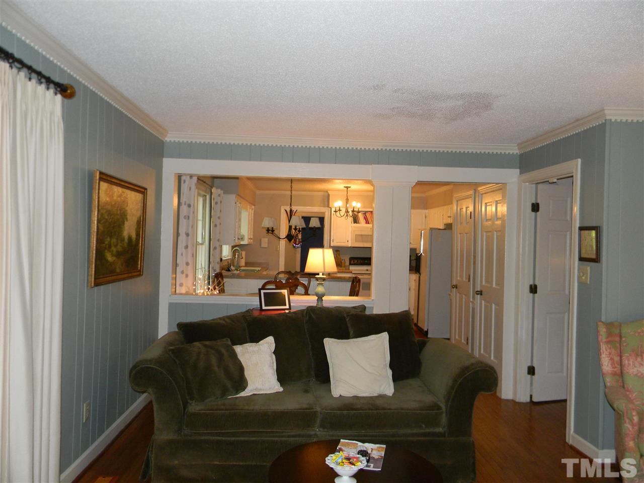 7919 Harps Mill Road Raleigh, NC 27615 - Photo 8 of 29 a living room with furniture and a large window