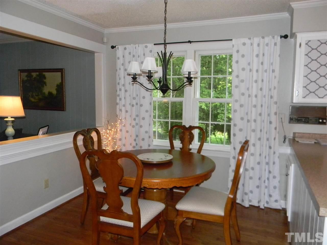 7919 Harps Mill Road Raleigh, NC 27615 - Photo 9 of 29 a dining room with furniture and window