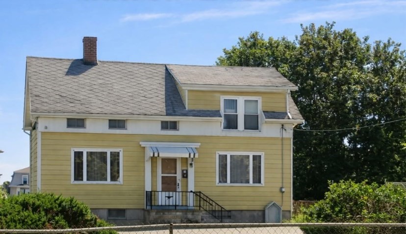 766 Second Street Fall River, MA 02721 - Photo 1 of 1 a front view of a house with a garden