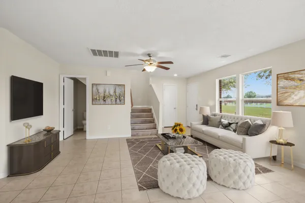 a living room with furniture and a flat screen tv