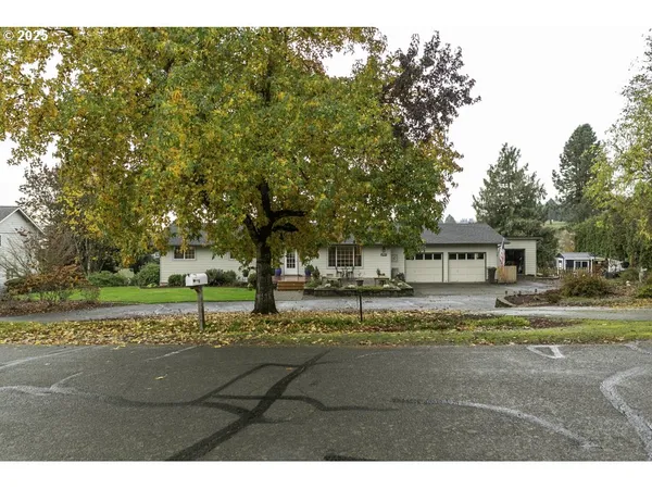 a view of a house with a yard