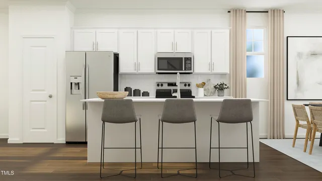 a view of kitchen with furniture and wooden floor