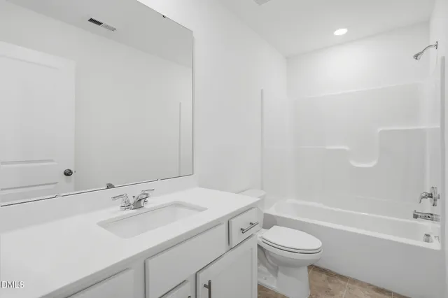 a bathroom with a sink a toilet and a bathtub