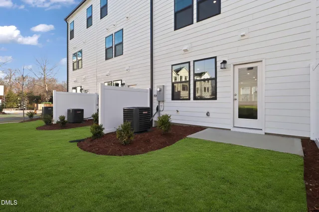 a view of a kitchen with wooden floor and electronic appliances