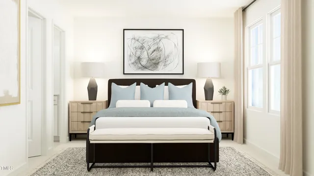 a bedroom with a bed and a painting on the wall