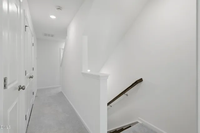a kitchen with stainless steel appliances granite countertop a sink and a refrigerator