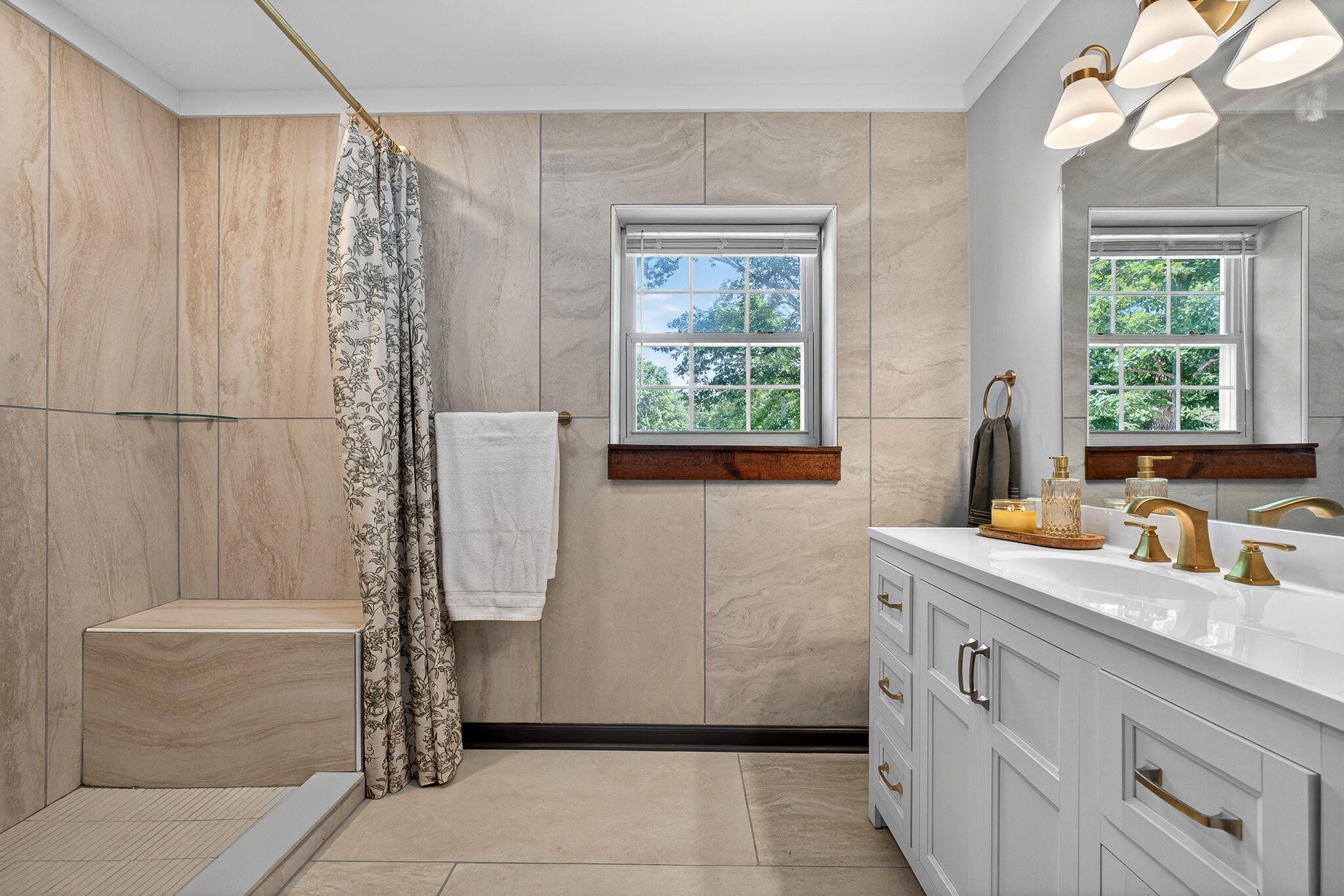 9388 Harrison Ferry Road McMinnville, TN 37110 - Photo 13 of 41 a bathroom with a granite countertop sink a mirror and a shower