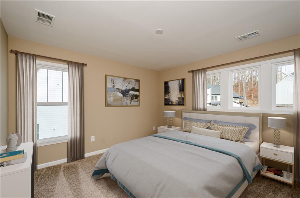8555 Scenic Ridge Way Ball Ground, GA 30107 - Photo 29 of 74 a bedroom with a large bed and a window