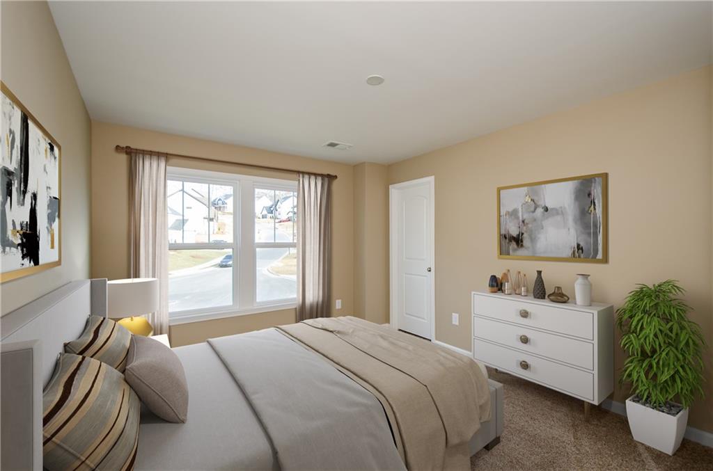 8555 Scenic Ridge Way Ball Ground, GA 30107 - Photo 38 of 74 a bedroom with a bed and a couch