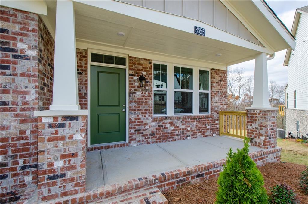 8555 Scenic Ridge Way Ball Ground, GA 30107 - Photo 5 of 74 a view of front door of house with outdoor seating